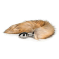 A sleek silver metallic anal plug with a natural brown and tan plush fox tail attachment from Fetish Collection