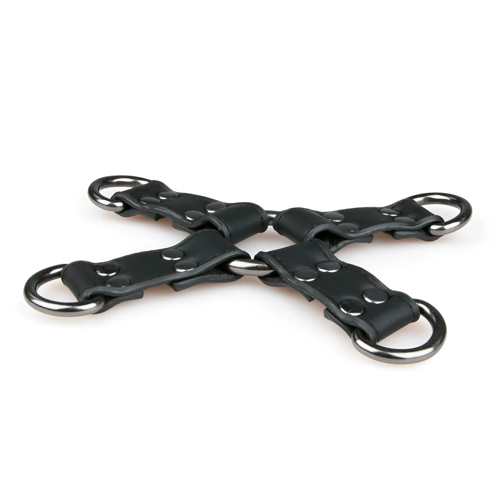 Black leather x-shaped restraint strap with silver metal rings and rivets from fetish collection hogtie black
