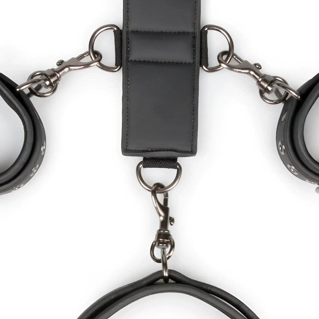 Black leather handcuffs with metal clasps and central strap from fetish collection neck and wrist restraint set