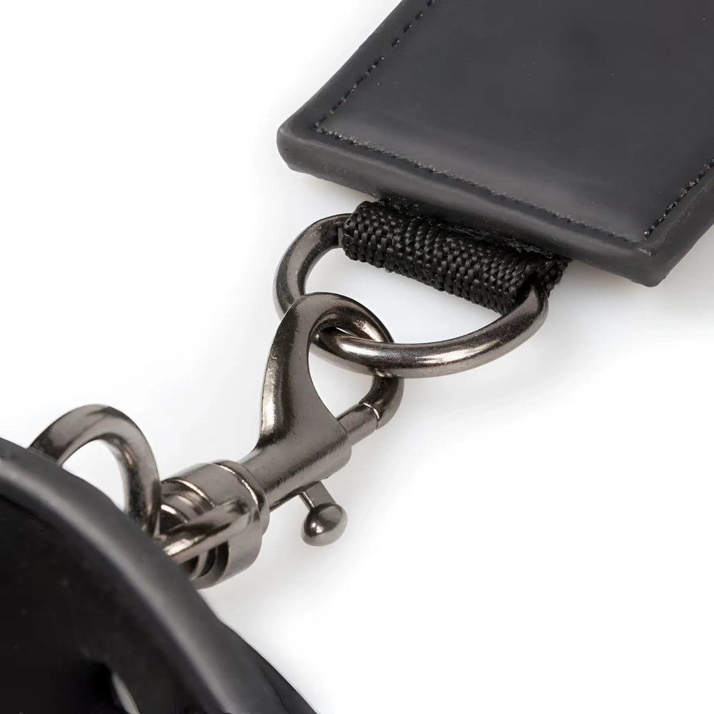 Black leather keychain with matte metal clasp and reinforced stitching from fetish collection neck and wrist restraint