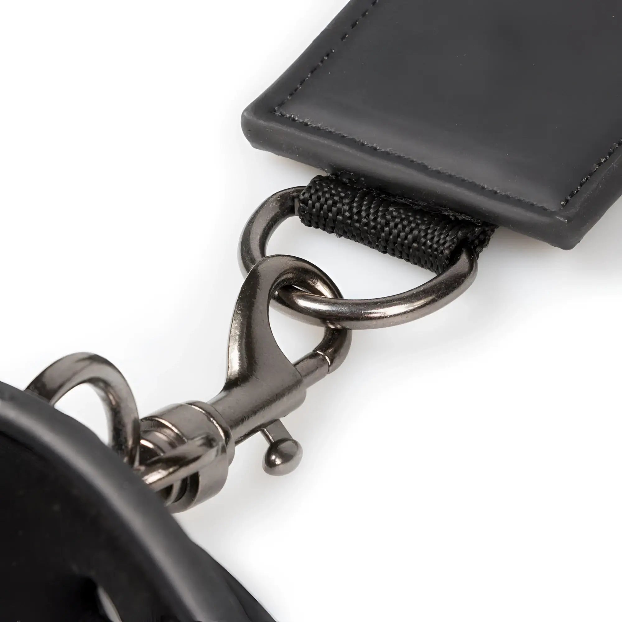 Black leather keychain with matte metal clasp and reinforced stitching from fetish collection neck and wrist restraint