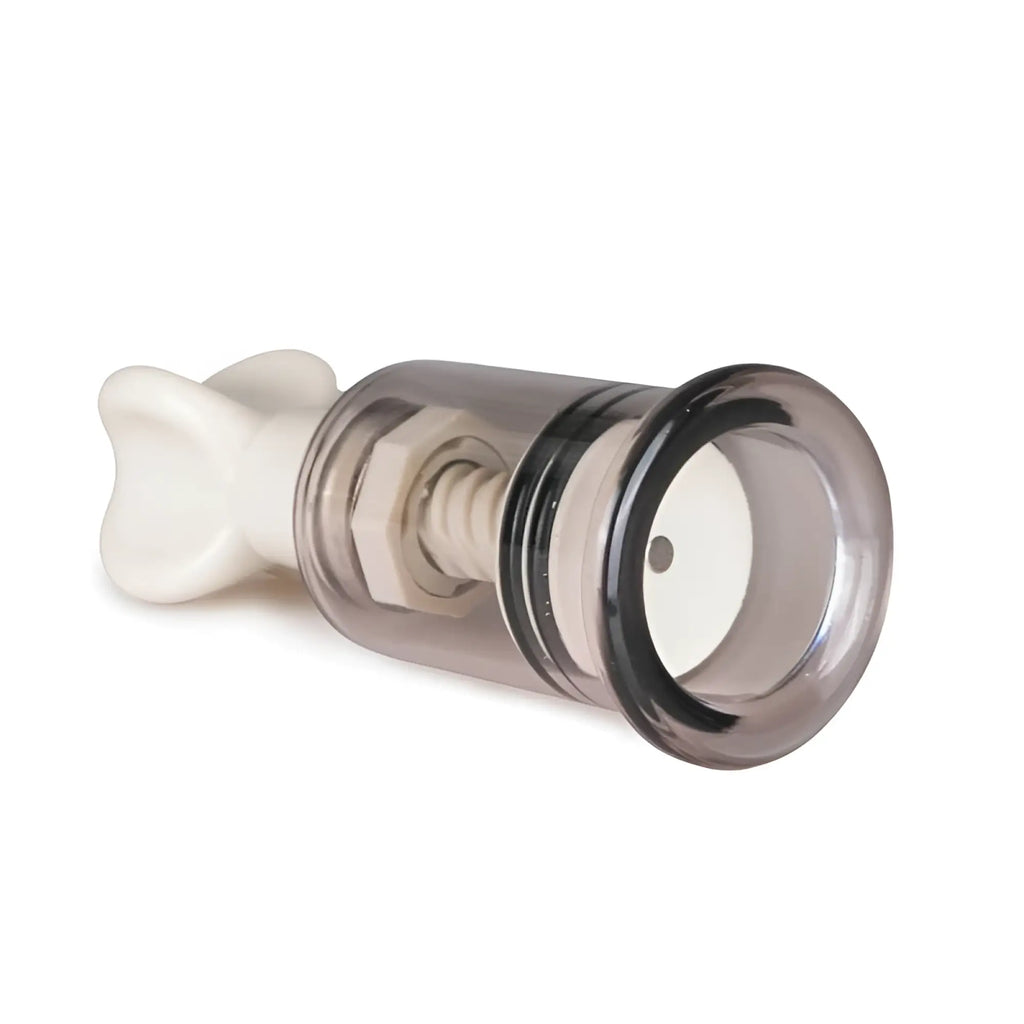 Transparent glass nipple and clit sucker with white plastic handle and internal mechanism from fetish collection small set