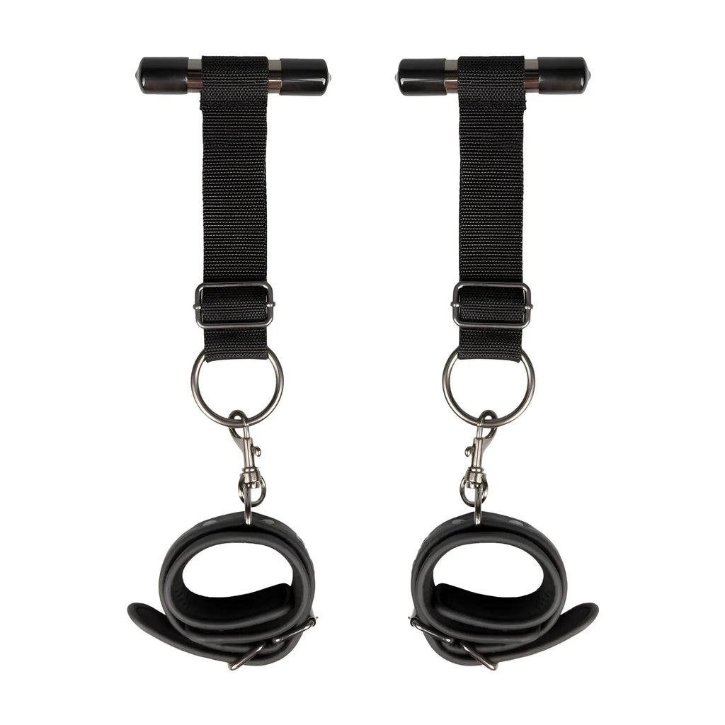 Black leather ankle cuffs from fetish collection with metal hardware and adjustable straps for bondage play