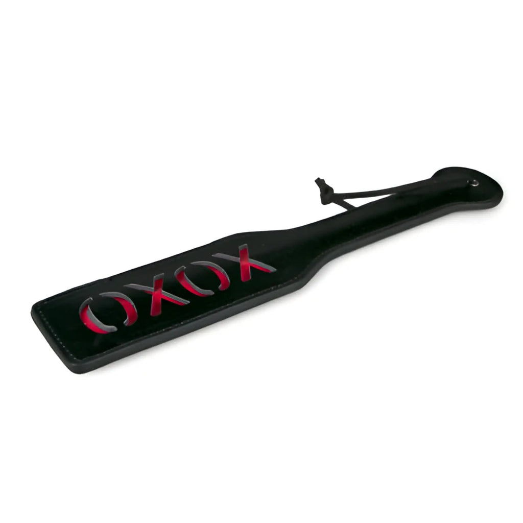 Fetish collection black paddle with red xoxo lettering and leather-like finish for BDSM play
