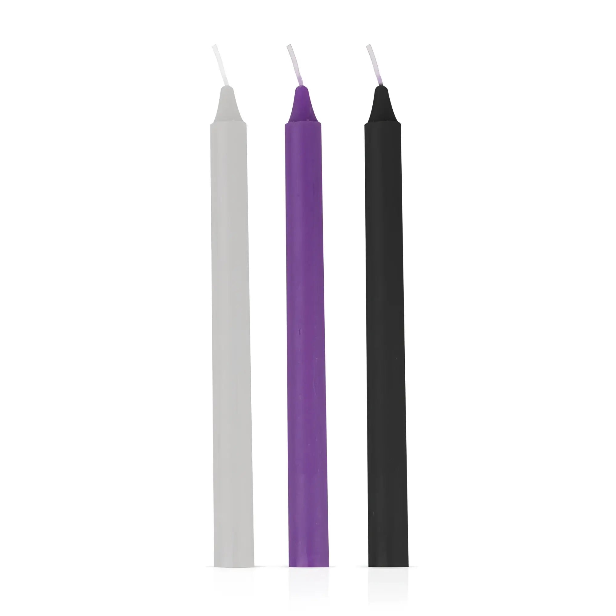 Three slender taper candles in white purple and black from the fetish collection sensual hot wax candles 3 pc set