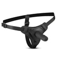 Black leather-like harness with a central realistic silicone dildo attachment from fetish collection strap-on