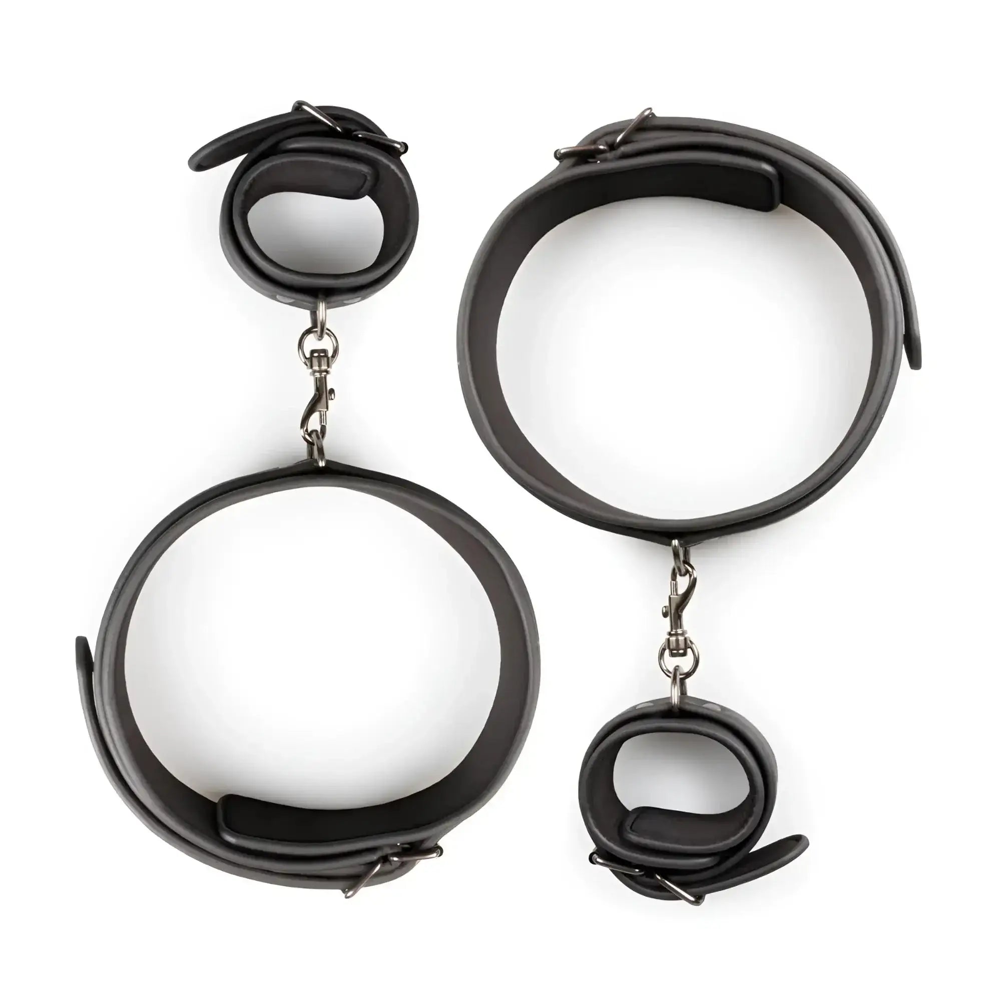 Fetish collection thigh and wrist cuff set featuring black leather handcuffs with silver-toned metal clasps