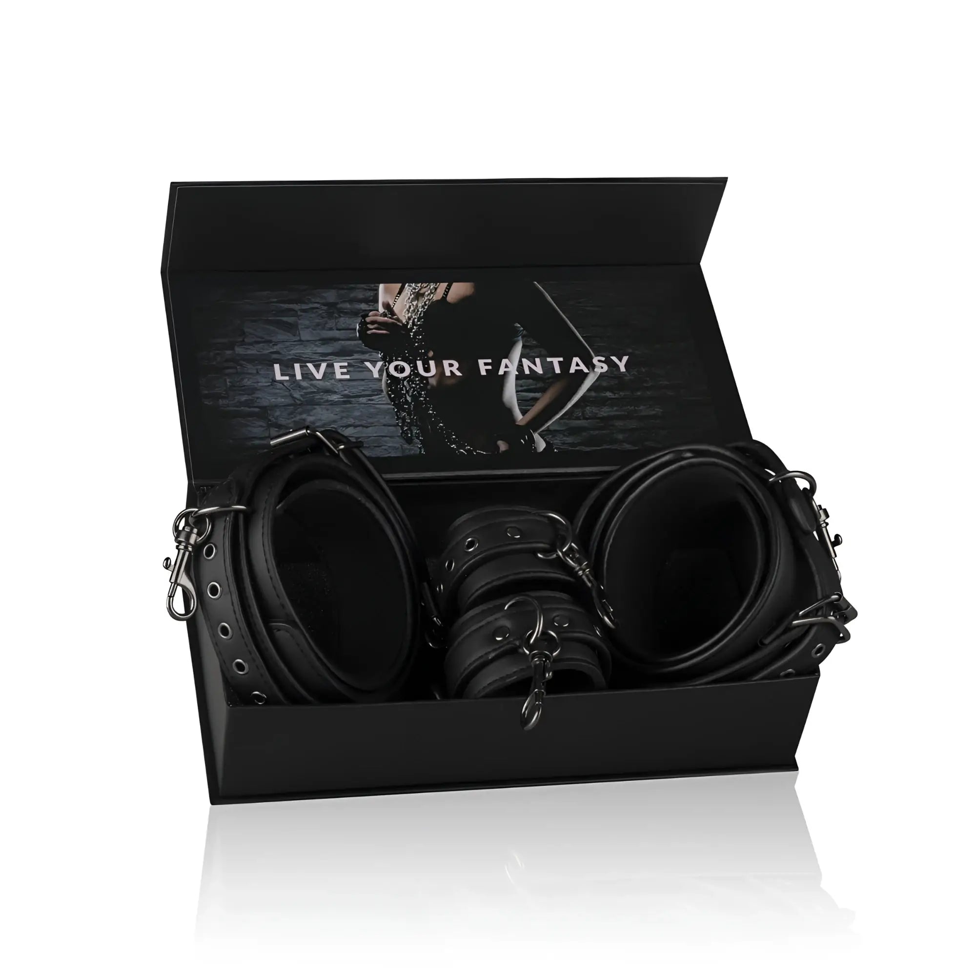 Black leather thigh and wrist cuff set with metal hardware in a sleek black box from fetish collection