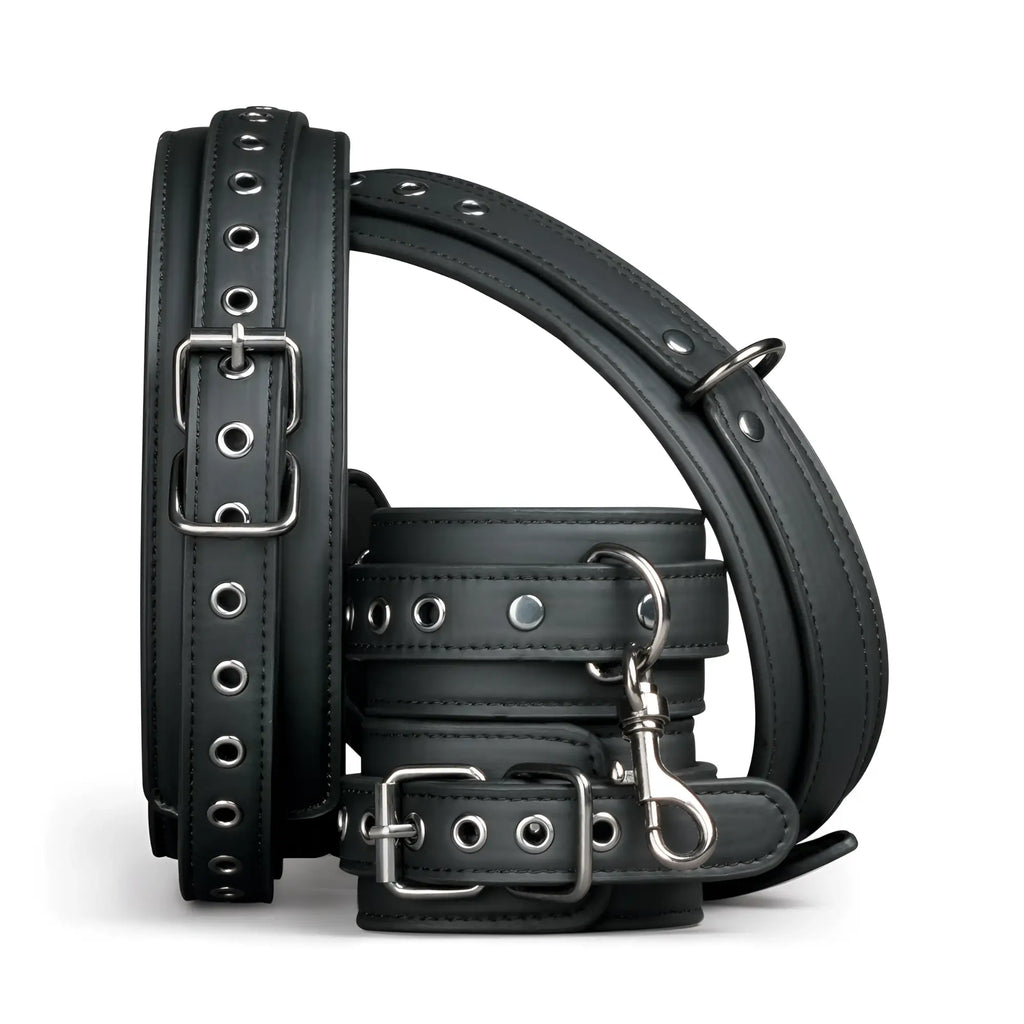 Black leather thigh and wrist cuff set with silver metal buckles and eyelets from fetish collection