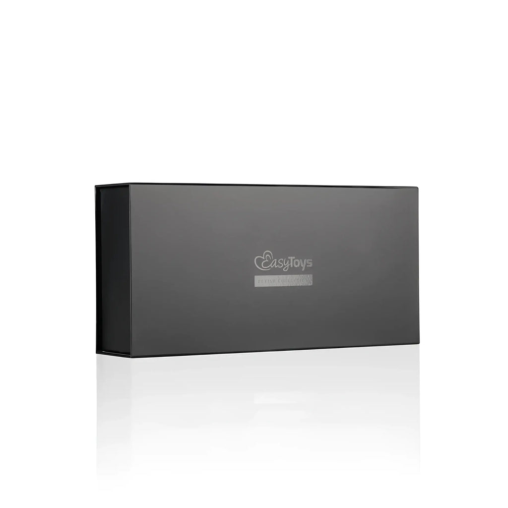Black rectangular gift box with silver easytoys logo containing fetish collection thigh and wrist cuff set