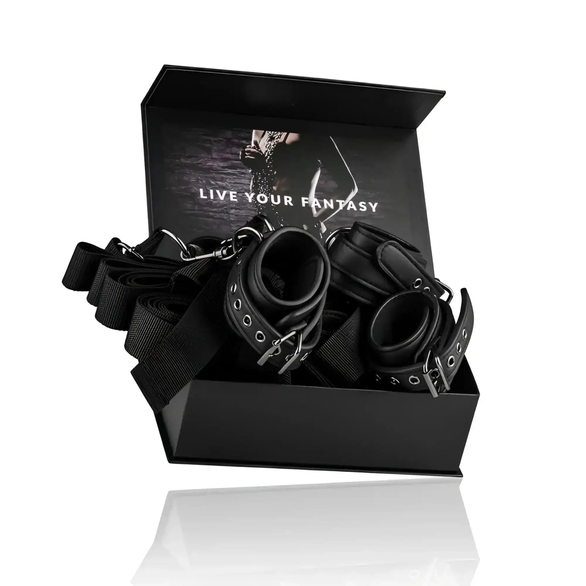 Black leather bondage set with metal hardware and adjustable straps from fetish collection under mattress restraint set