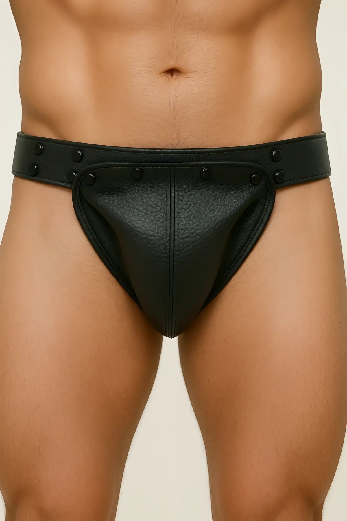 Fizx jockstrap black leather briefs with textured surface and decorative black studs along the waistband