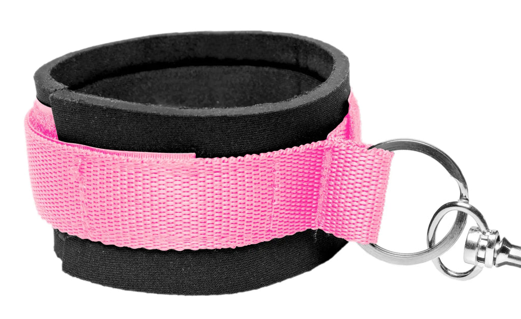 Pink and black fabric wrist cuff with metal key ring attachment from frisky bedroom restraint kit pink
