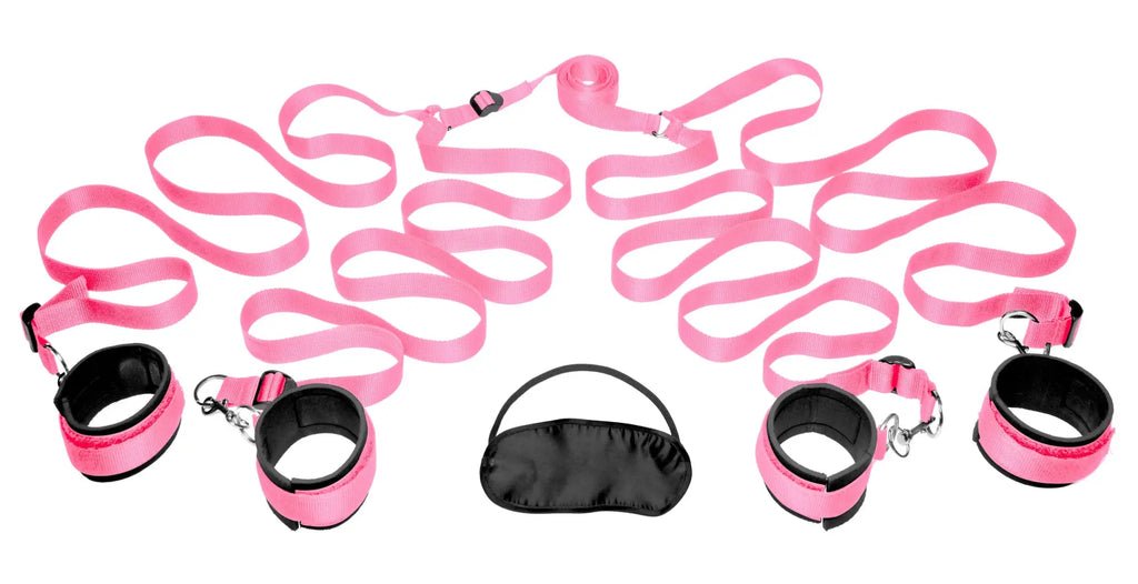 Pink satin bondage kit with black accents and metal hardware for frisky bedroom restraint play