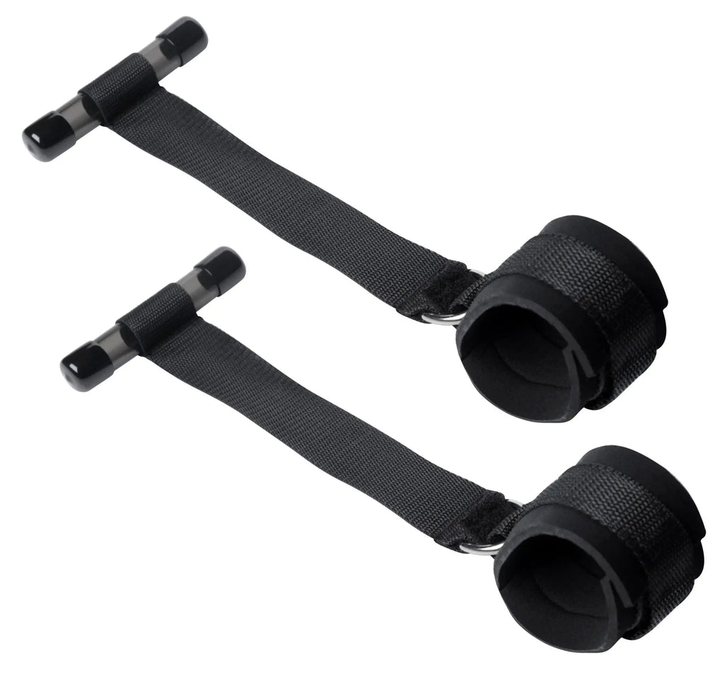 Black fabric wrist cuffs with adjustable straps and plastic handles for frisky entryway door restraints