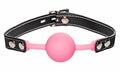 Pink silicone ball gag with black leather straps and silver metal hardware glow in the dark frisky glow gag