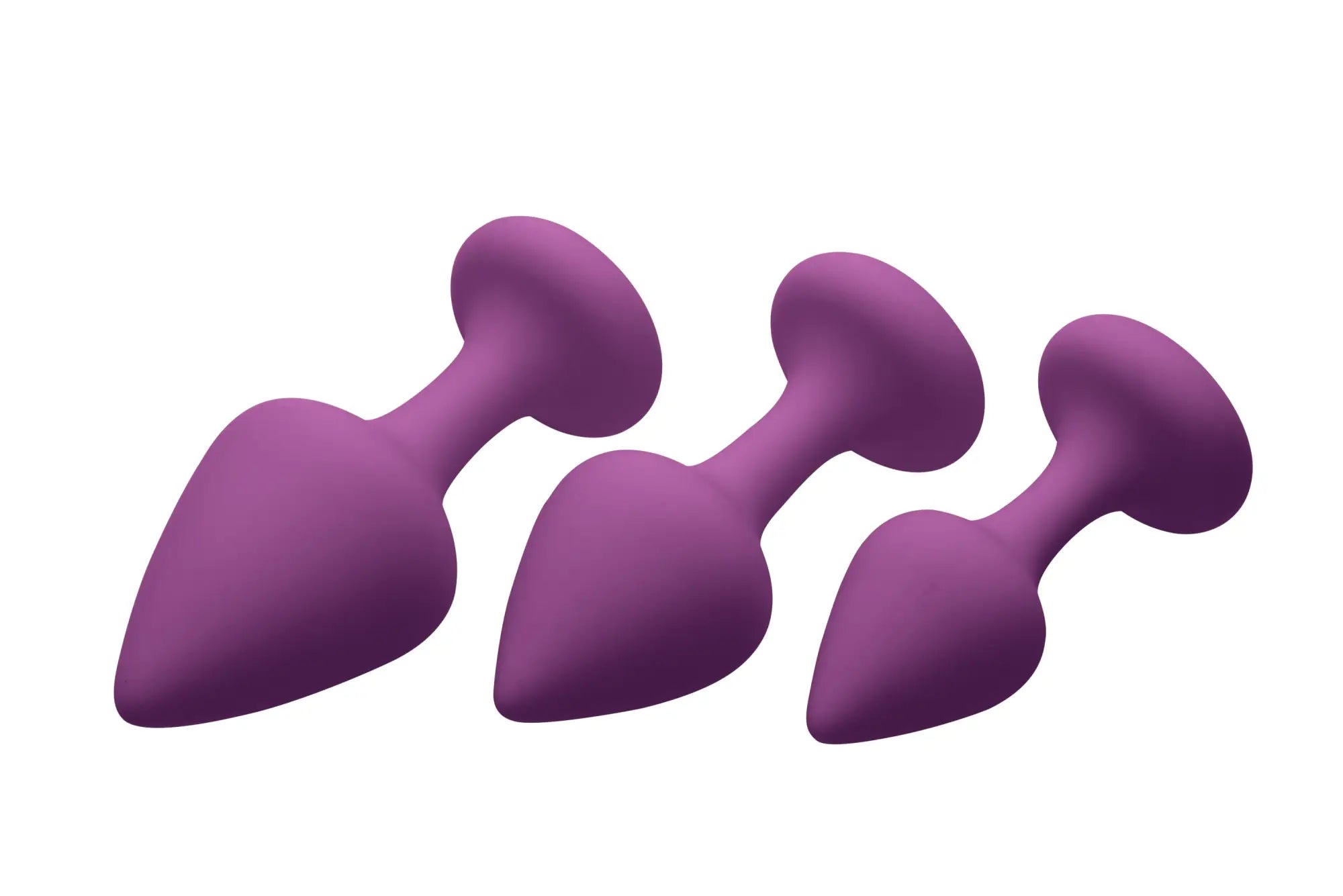 Three purple silicone anal plugs of varying sizes arranged diagonally from frisky purple pleasures 3 pc silicone anal plugs