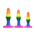 Frisky rainbow ready anal trainer set with three sizes of rainbow-striped silicone butt plugs with blue stems and pink bases