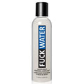 A sleek transparent bottle of fuckwater hybrid cream lubricant with black cap and blue-black label contains water-based lubricant