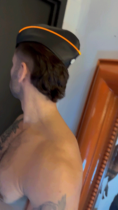 Black garrison hat with bright orange trim made of durable fabric for stylish everyday wear