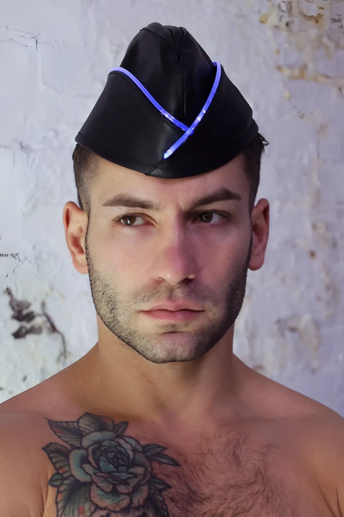 Black leather garrison hat with glowing blue led trim designed for stylish and modern headwear use