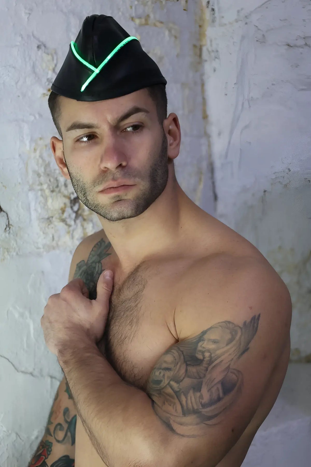 Black leather garrison hat with glowing green neon trim featuring a stylish and futuristic design