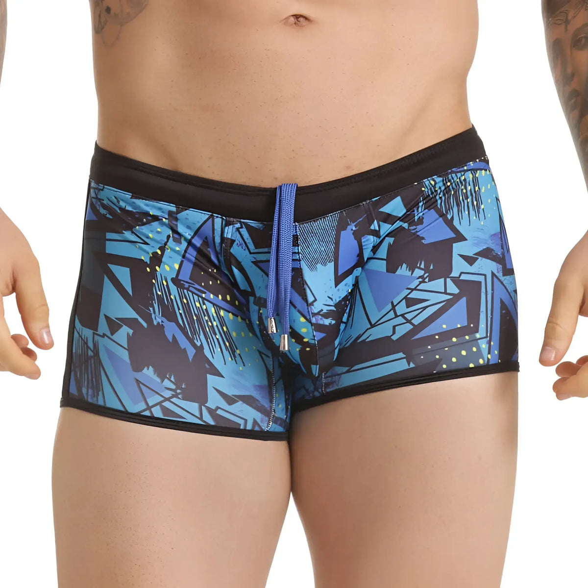 Gigo abstract swim trunk featuring blue and black graffiti pattern with purple drawstring for casual beachwear