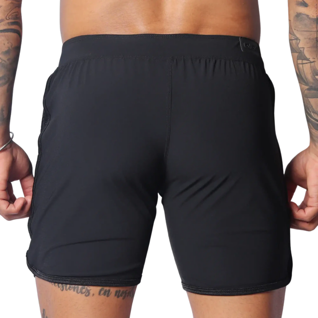 Rear view of black Gigo Ambitious athletic shorts featuring a flat waistband and minimalist, seamless design.