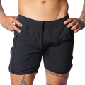 Black athletic shorts with an elastic drawstring waist, side pockets, and perforated panels on the side seams.