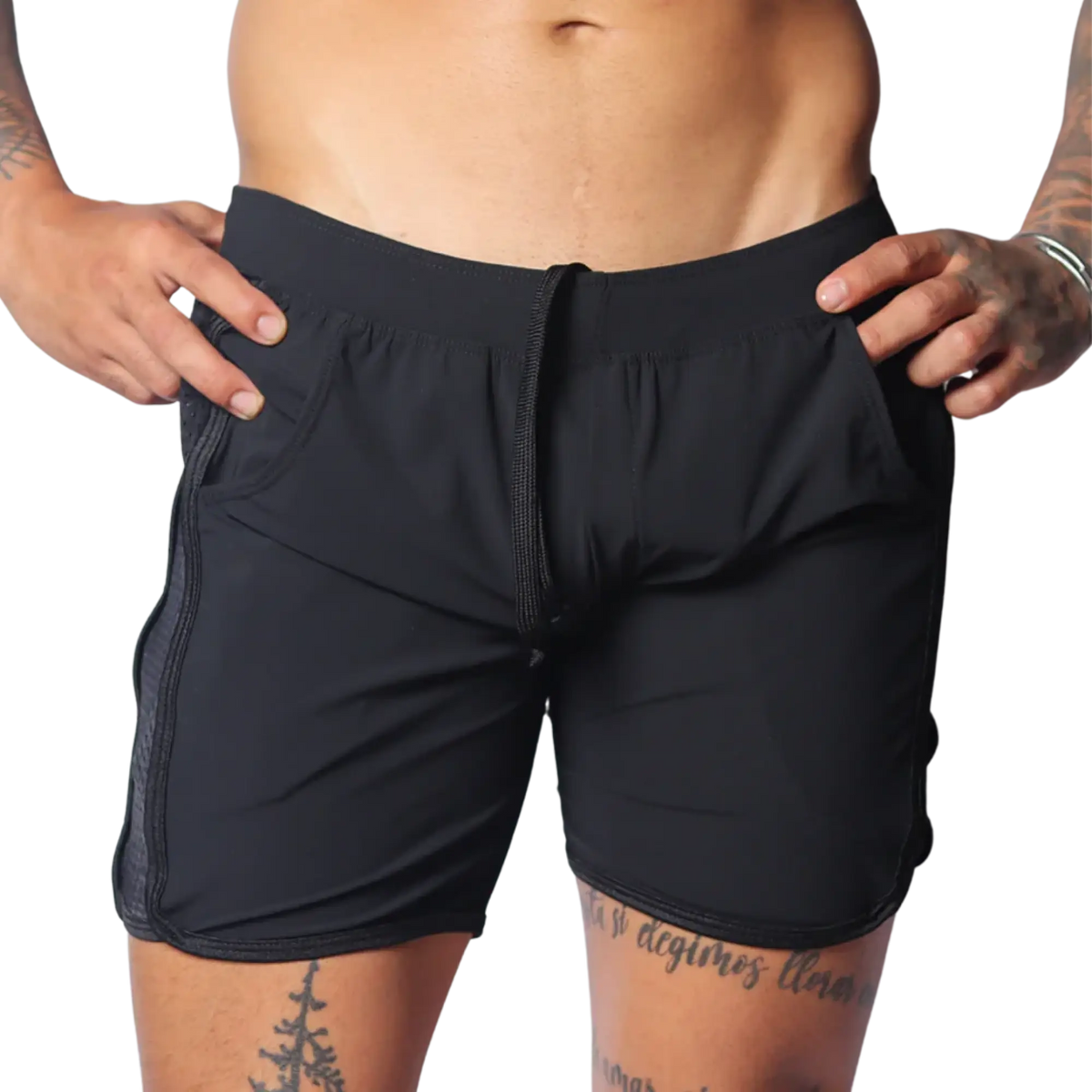 Black athletic shorts with an elastic drawstring waist, side pockets, and perforated panels on the side seams.