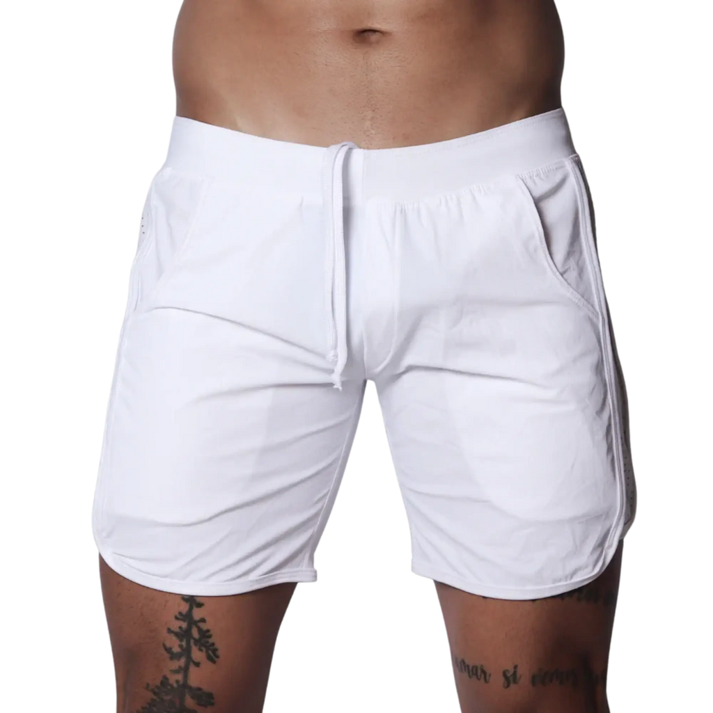 White athletic shorts featuring an elastic waistband with drawstring, side pockets, and curved hem detail.
