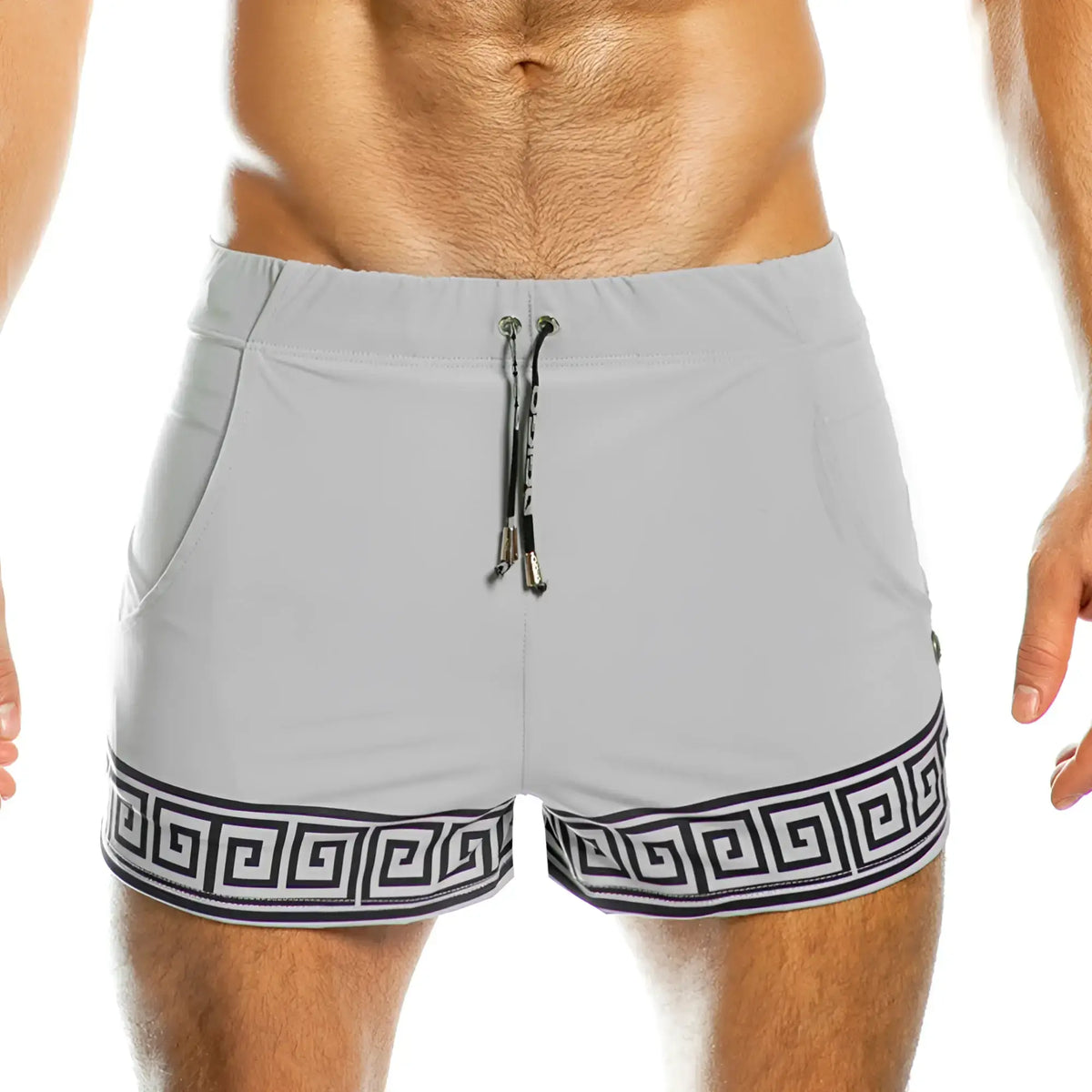 Light gray gigo arabesque swim trunks with bold black greek key hem and matching drawstring with metallic aglets