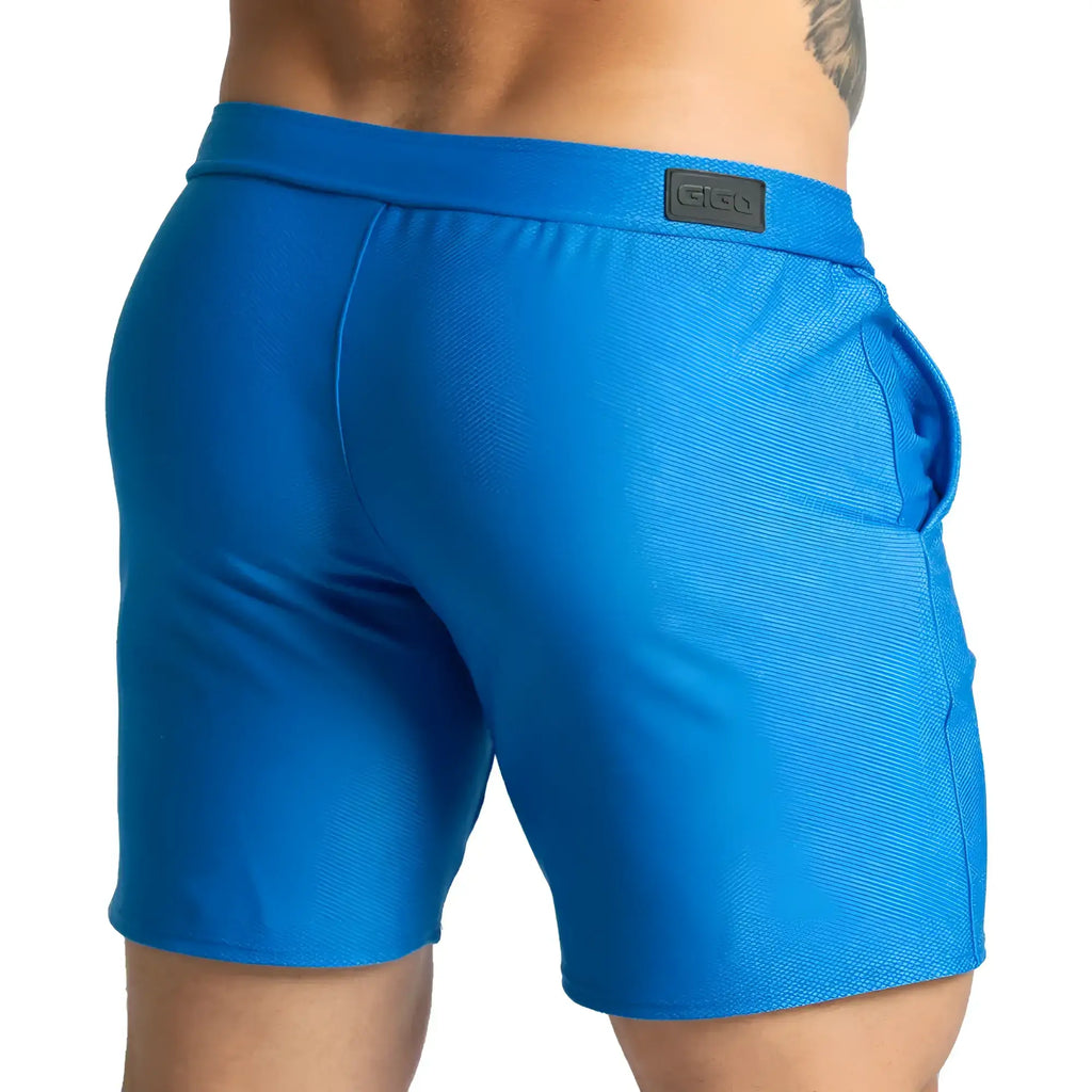 Gigo Belucci blue shorts with textured fabric and a black brand patch on the waistband for athletic wear