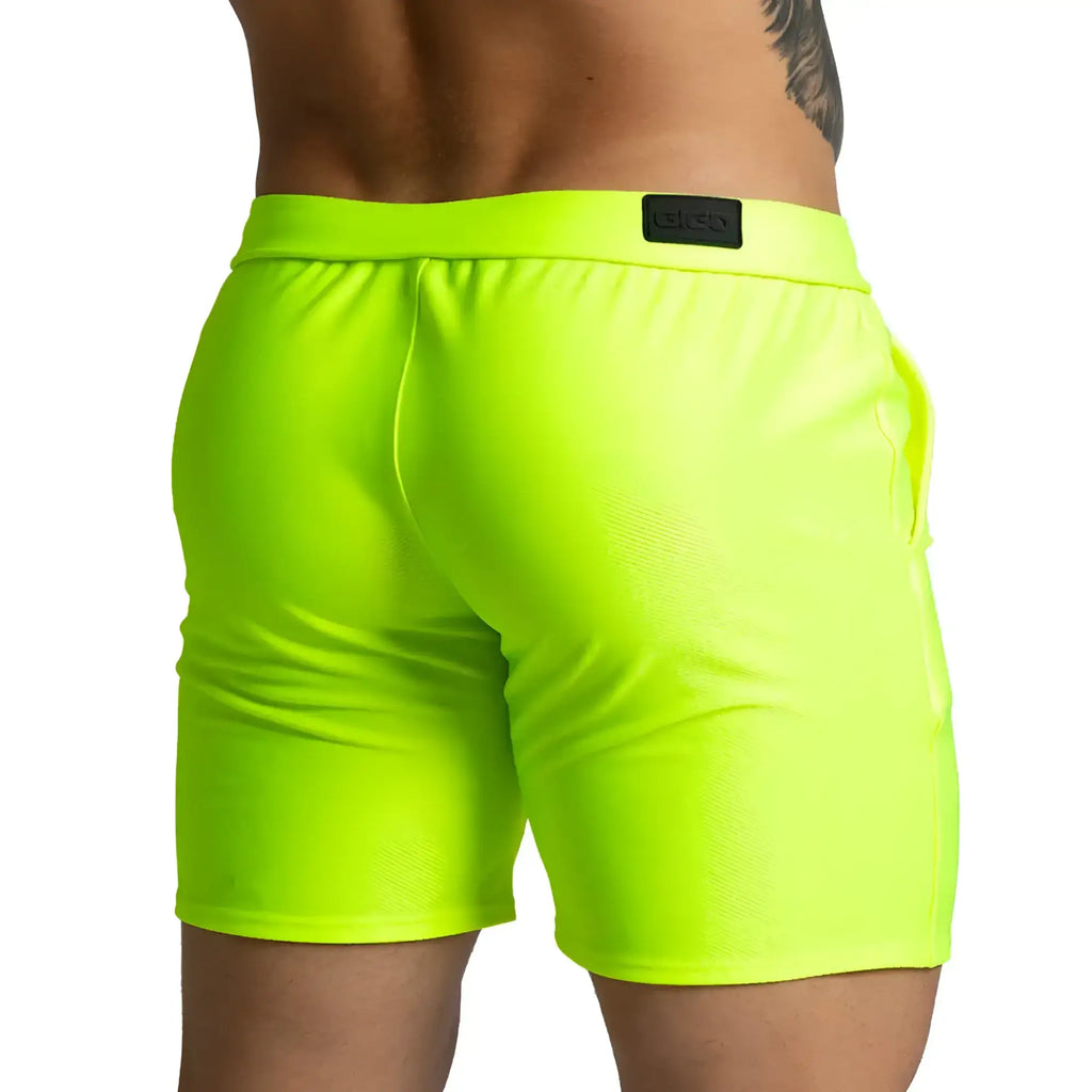 Neon green athletic shorts gigo belucci yellow short with black brand patch on the waistband for sportswear use