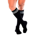 Gigo black socks are knee-high ribbed cotton socks with two white stripes and a brand logo on the cuff