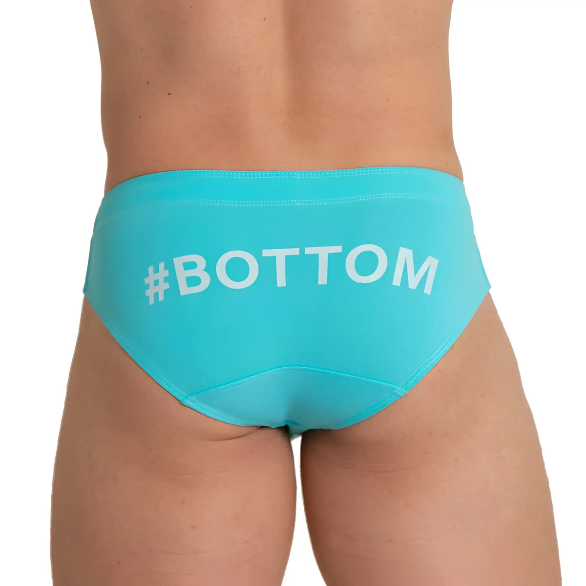 Back view of turquoise gigo bottom blue swim brief swim trunks with white bottom text printed across the back