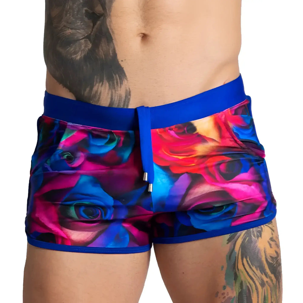 Gigo carnations beachwear vibrant floral-patterned swim trunks with bold blue waistband and matching drawstring