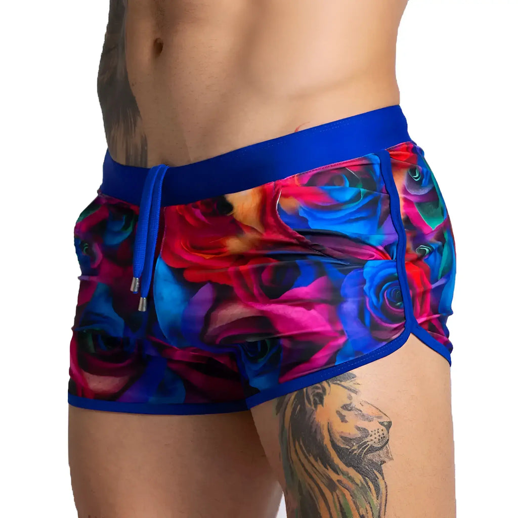 Gigo Carnations beachwear multicoloured rose-patterned swim trunks with bold blue waistband and matching drawstring