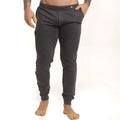 Dark gray pinstripe joggers with elastic cuffs and a subtle button at the waistband from gigo casual sportpants
