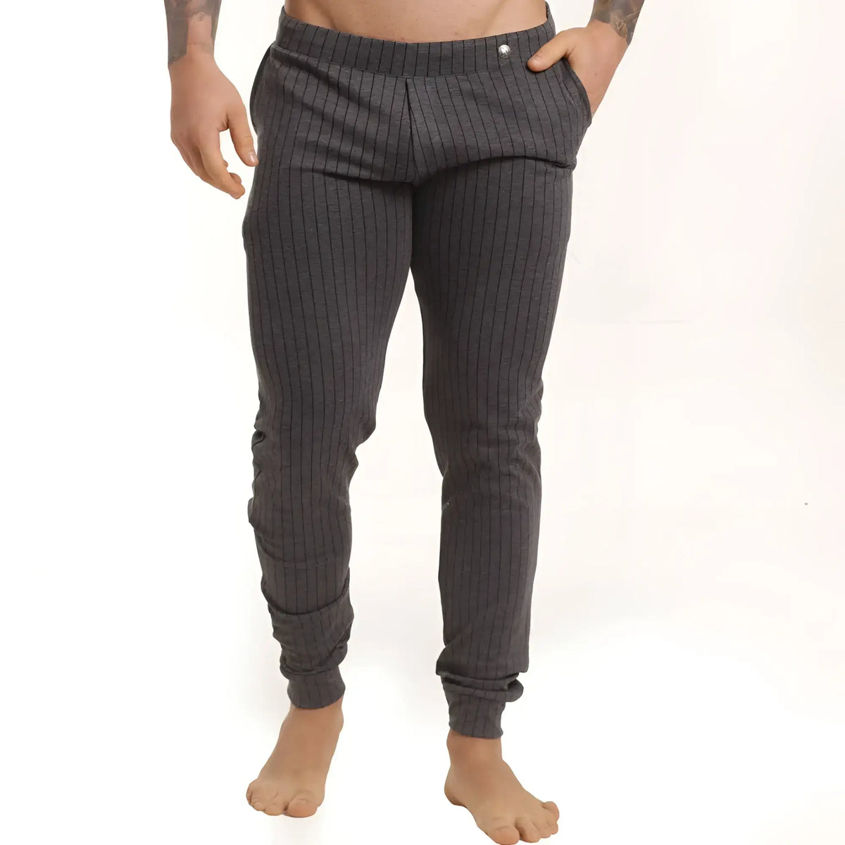 Dark gray pinstripe joggers with elastic cuffs and a subtle button at the waistband from gigo casual sportpants
