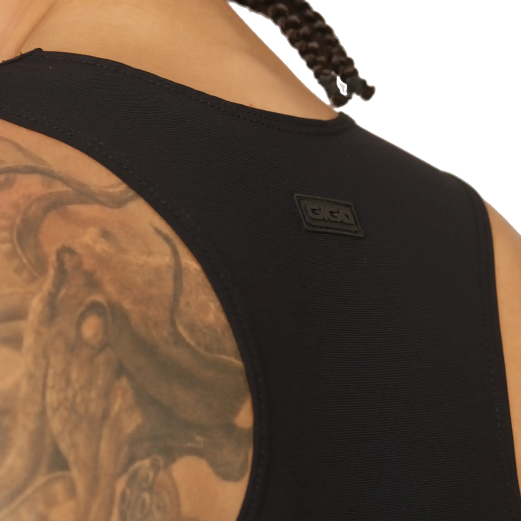 Gigo Club black tank top made of textured fabric with a small rectangular logo patch on the shoulder