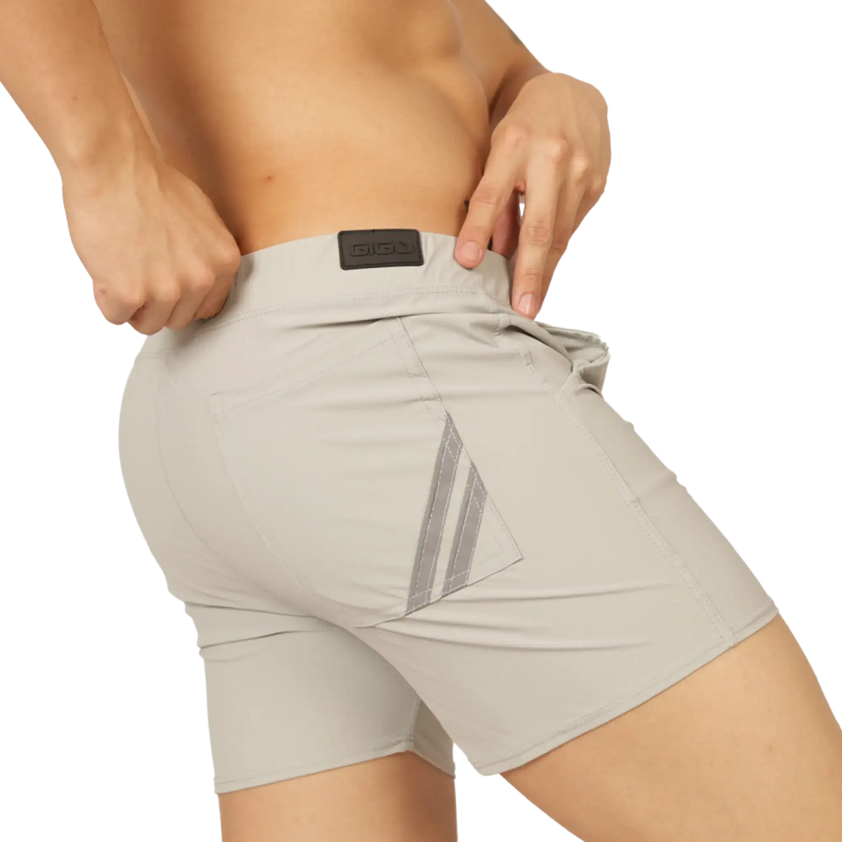 Beige gigo club gray athletic shorts back side with reflective diagonal stripes and black brand patch at waistband
