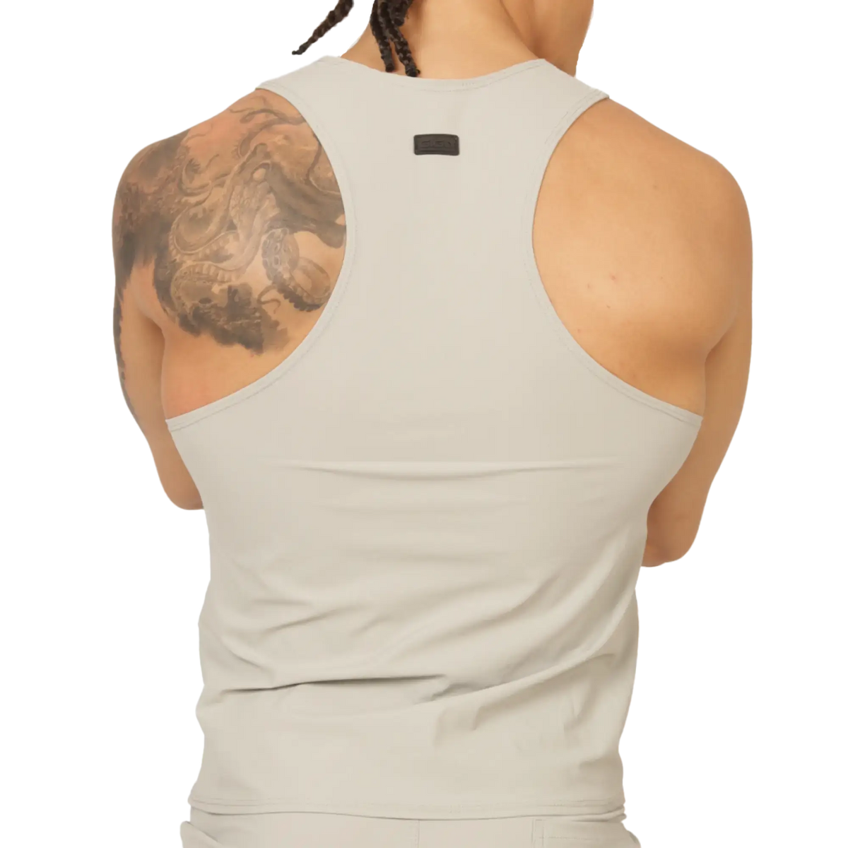 A sleek off-white racerback tank top with minimalist design and small black gigo club brand tag at the neckline