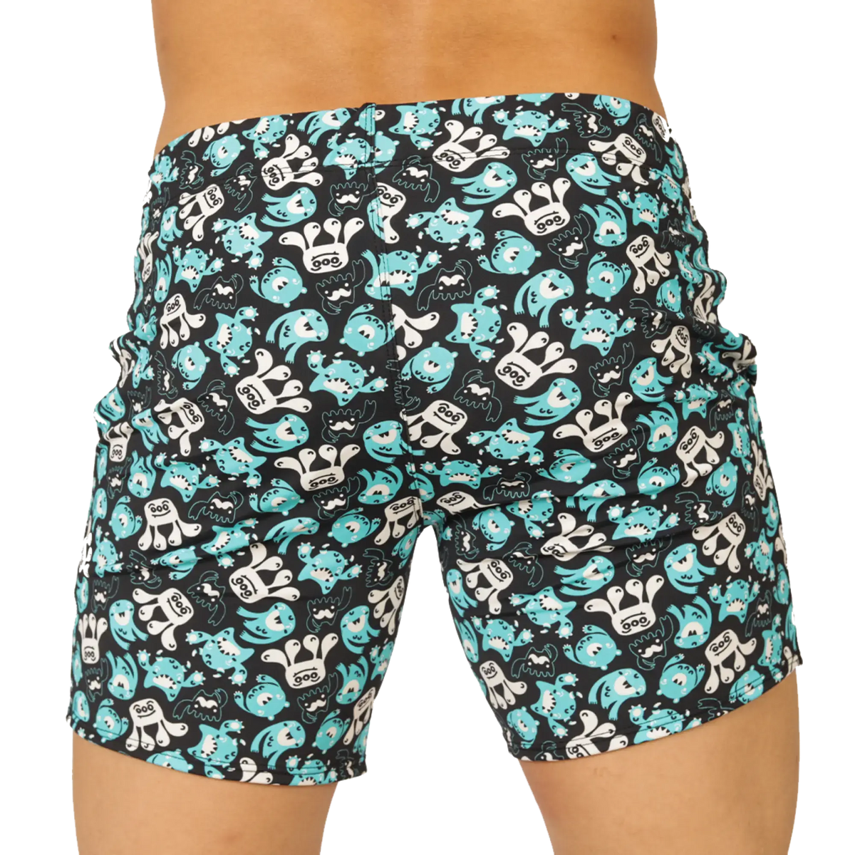 Black swim trunks by gigo comics beachwear with turquoise and white cartoon monster pattern for beach use