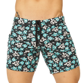 Black swim trunks from gigo comics beachwear with teal and white cartoon monsters featuring goo on chests