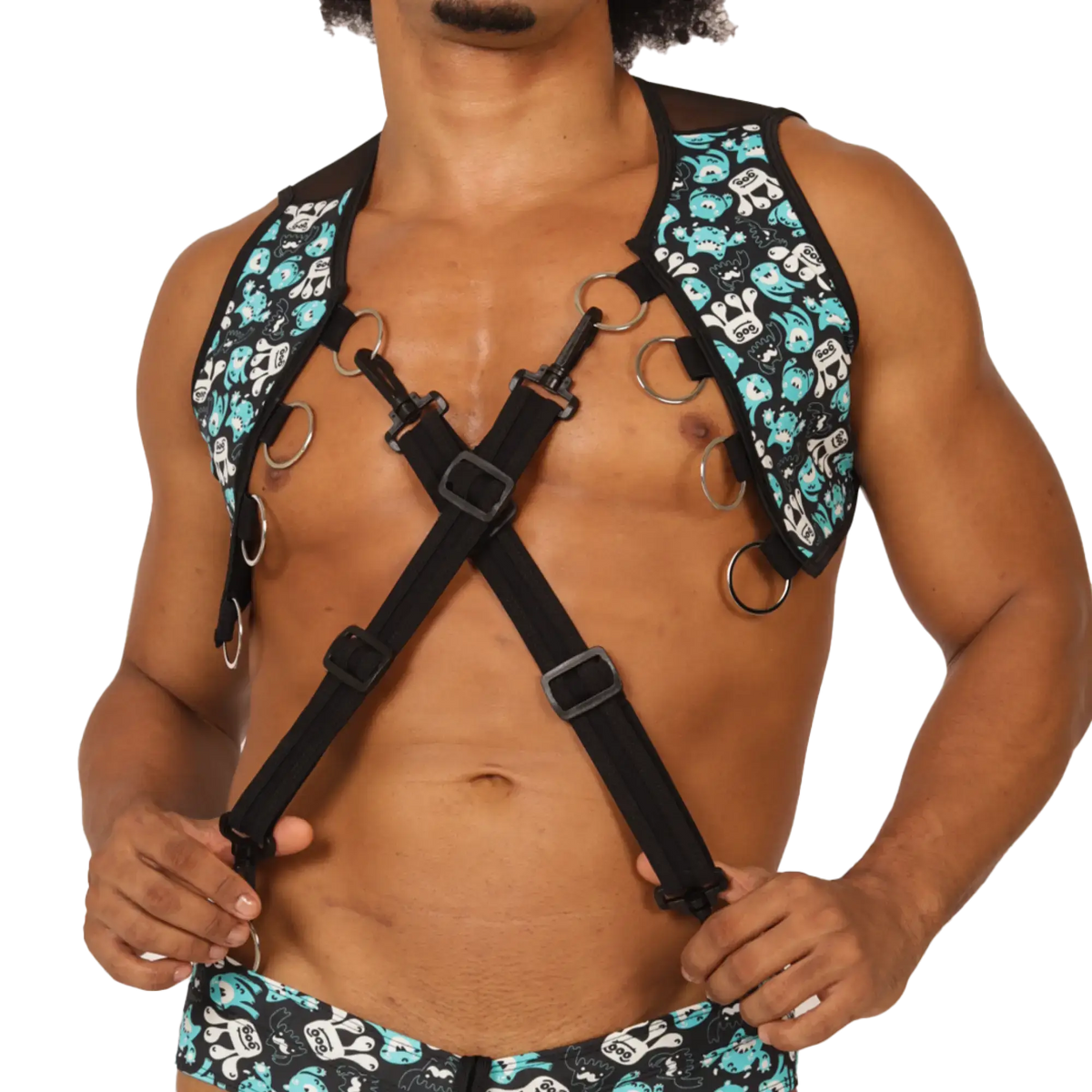 Black gigo comics vest harness with teal and white skull pattern adjustable straps and metal rings visible on front