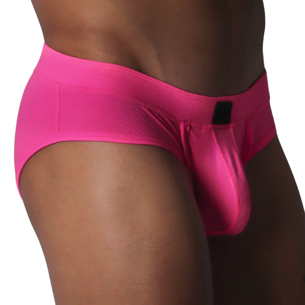 Fuchsia brief in textured, honeycomb-patterned fabric featuring a contoured pouch and a small black rectangular logo.