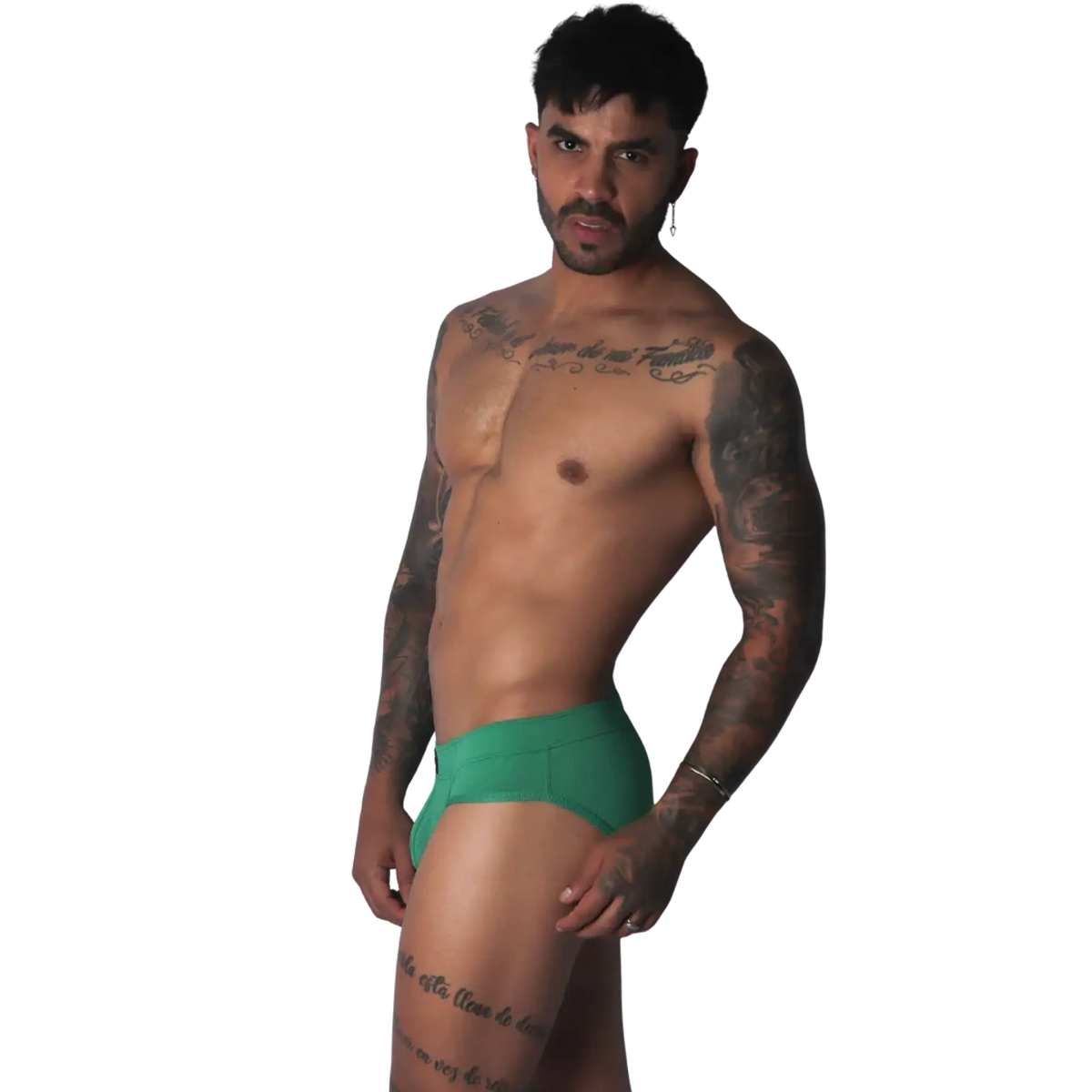 Green ribbed fabric brief with a solid waistband and a form-fitting cut worn by a tattooed man.