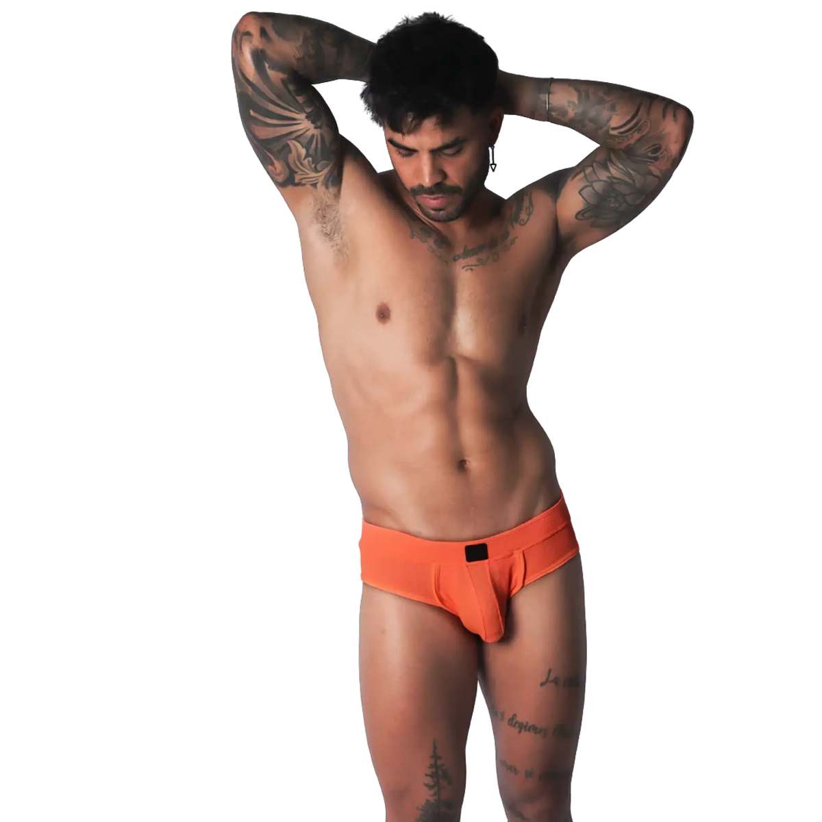 Bright orange low-rise brief in a textured, breathable fabric with a small black center-front logo patch.