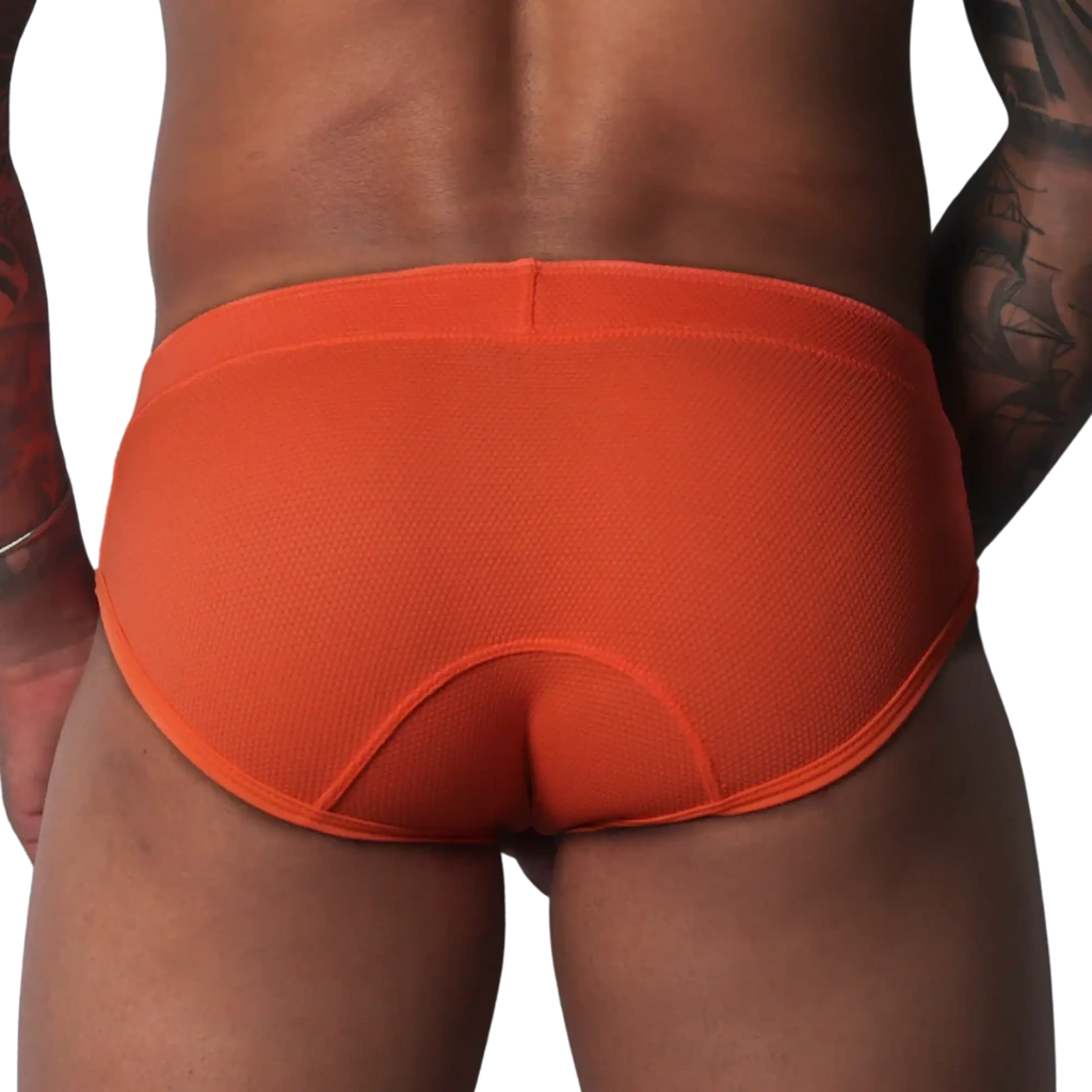 Bright orange, textured athletic brief with a wide waistband and contoured back panel seams.